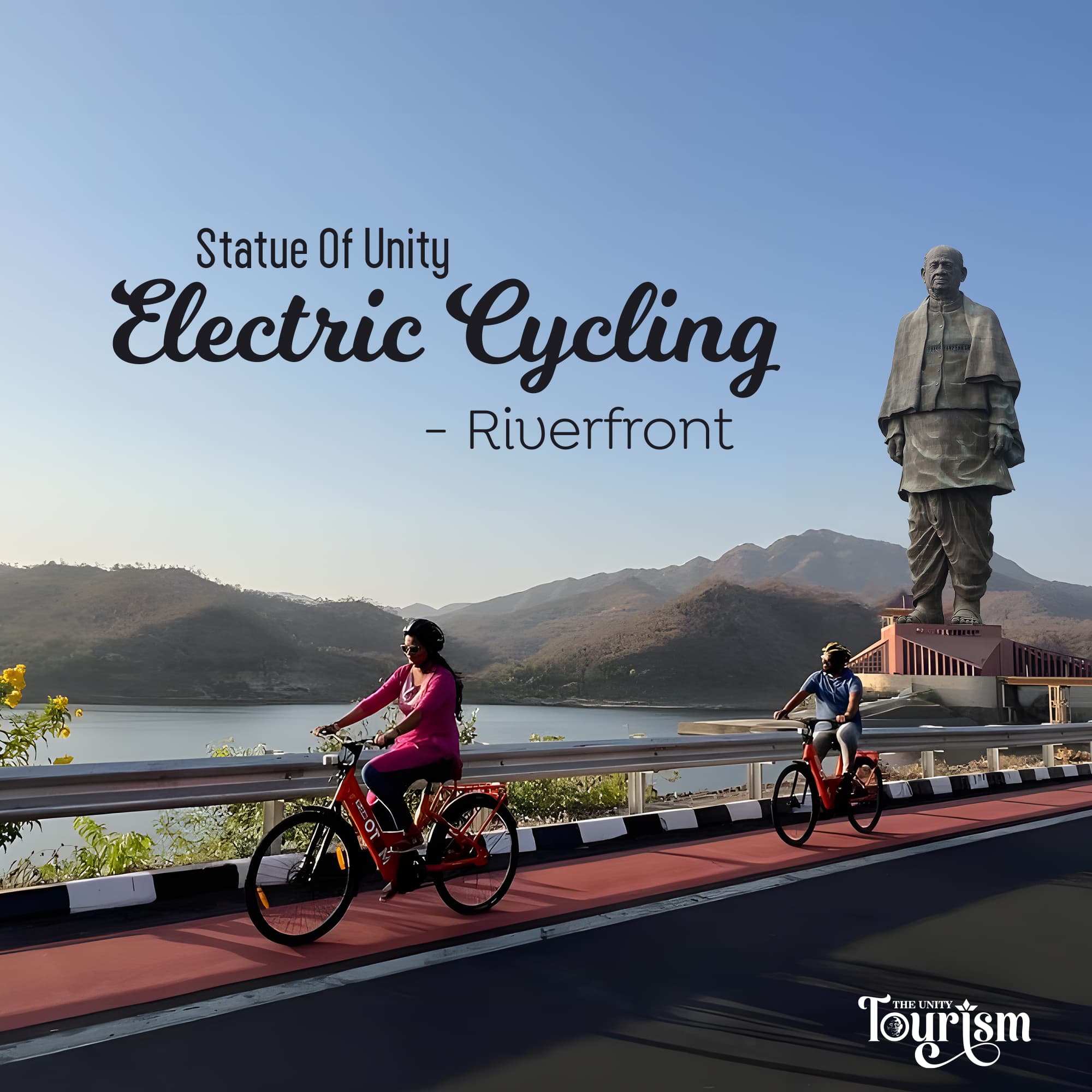 Tourists enjoying electric cycling along the riverfront with the Statue of Unity in the backdrop and scenic hills