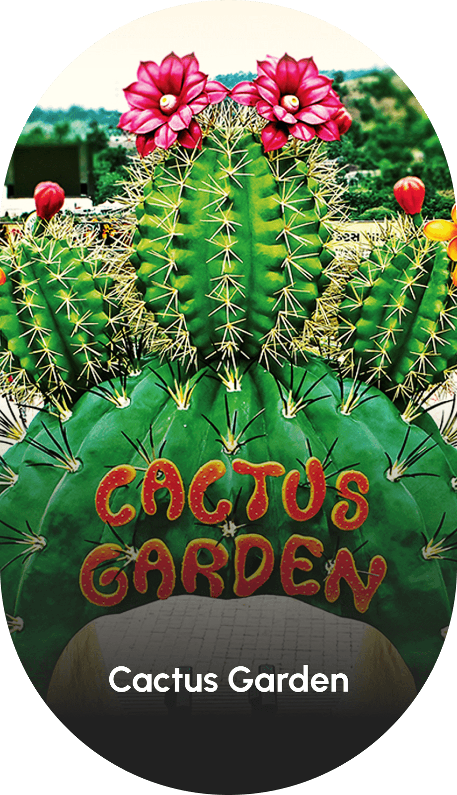 Entrance of Cactus Garden at Statue of Unity featuring giant decorative cactus sculptures and colorful flowers