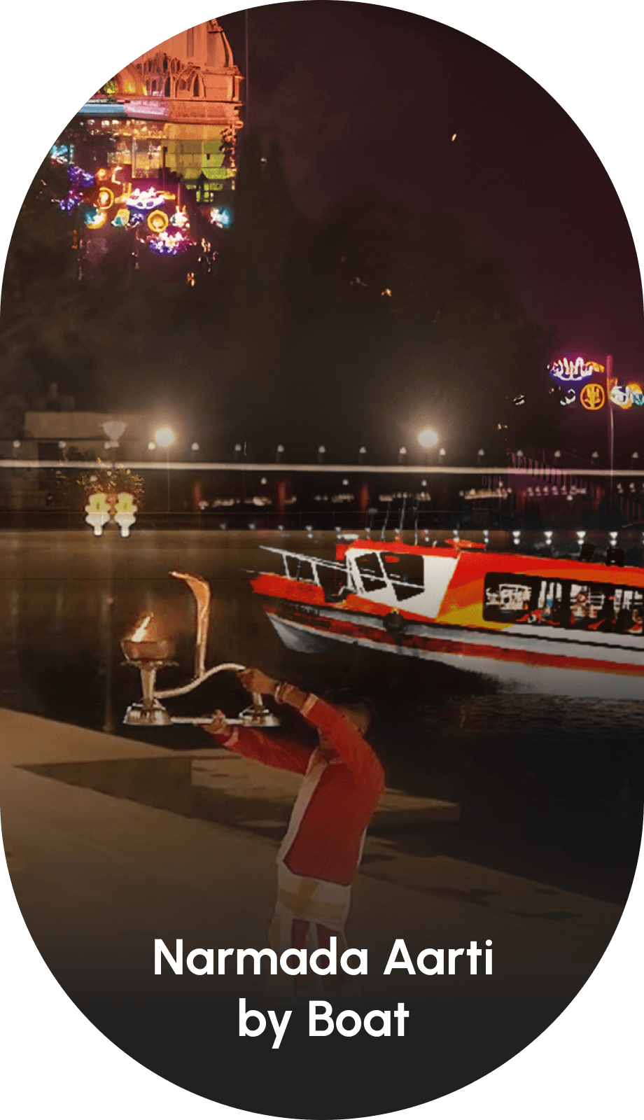 Devotees watching Narmada Aarti Darshan by the riverside with priests performing rituals and a boat on the water near Statue of Unity.
